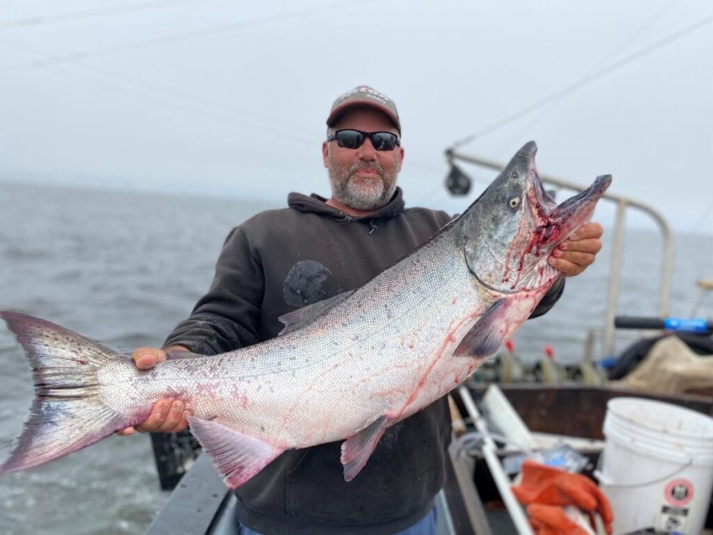 Brand Little holding a salmon