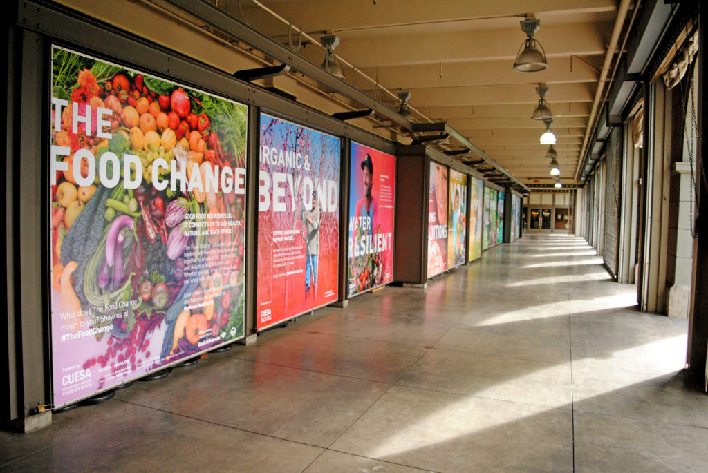 Ferry Building arcade view of "The Food Change" photomural exhibit
